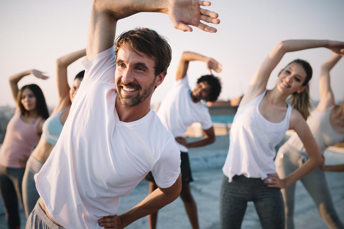 Group of happy friends exercising.