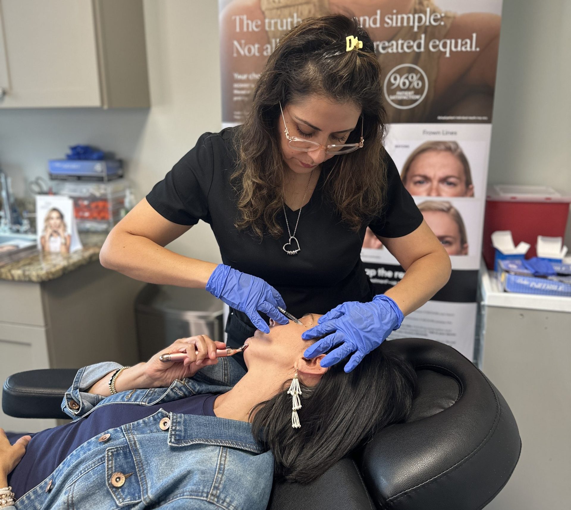 Cintia Harris, NP performing injectable treatment with neuromodulator